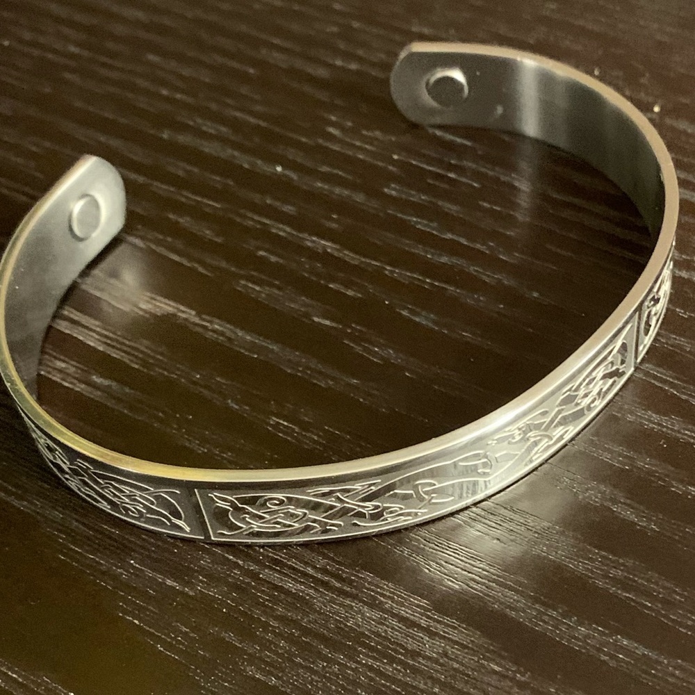 Silver cuff bracelet  with celtic style engraving